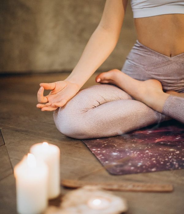 Woman in a calm yoga pose, embodying inner balance and focus.